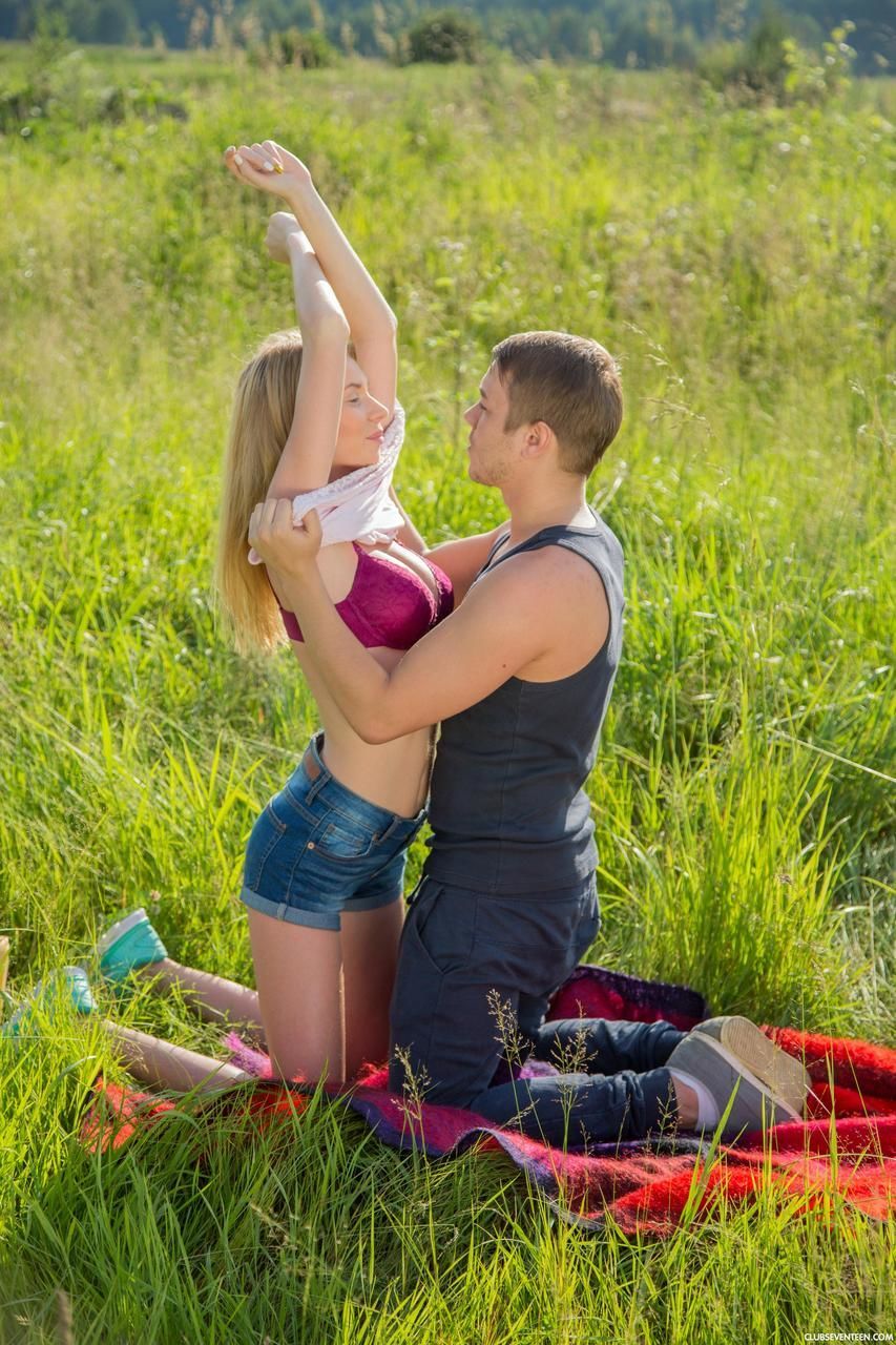 Hot blonde teen gets her bald twat hammered outdoors in a field