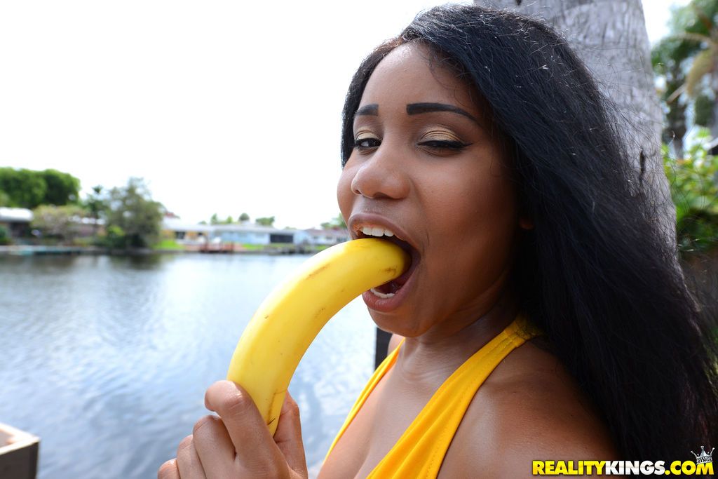 Black chicks Tara Fox and Indigo Vanity suck on bananas attired in swimsuits