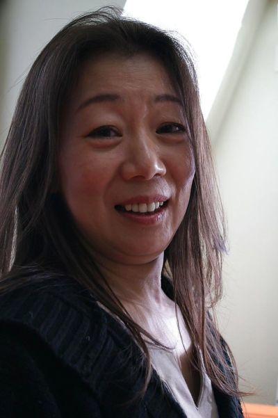 Asian mature brunette Yoshiko Makihara is showing off in sexy pantyhose