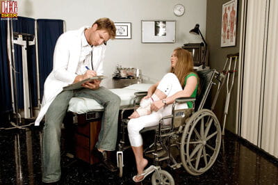 Wheelchair bound Megan Reece giving doctor footjob after cunnilingus
