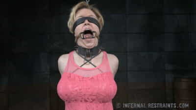 Blonde female Darling is subjected to anal penetration while in bondage