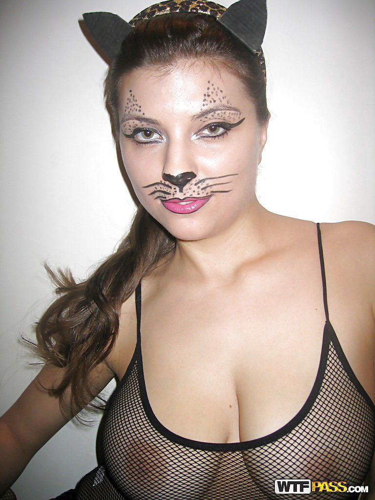 Playful kitty with big tits posing in lingerie and stockings