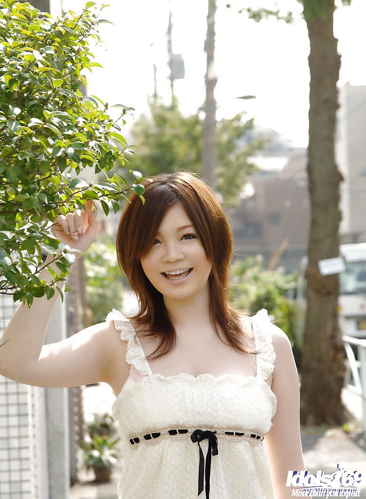 Asian schoolgirl Nami Ogawa revealing her massive bosoms and nice fanny