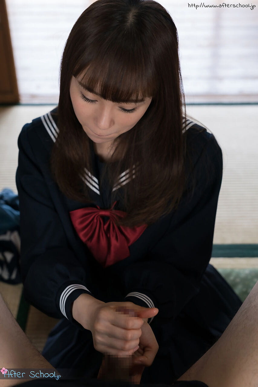 Japanese schoolgirl removes over the knee nylons before giving a footjob