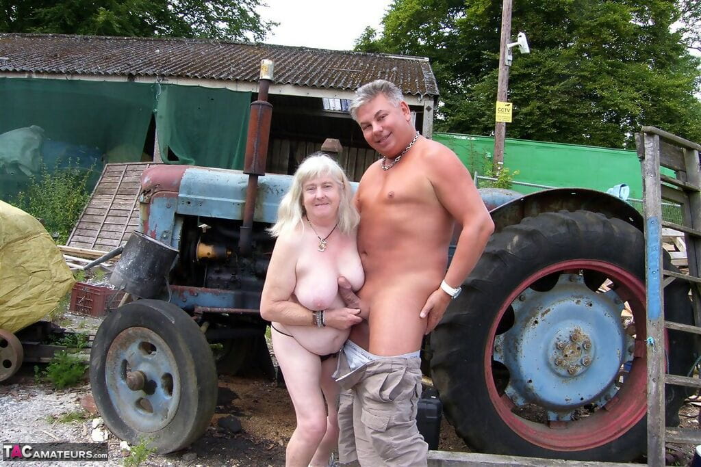 Fat granny takes a cumshot on large tits after sex on the farm