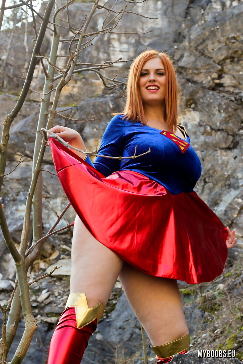 Thick redhead Alexsis Faye releases her giant tits from Superman osutfit