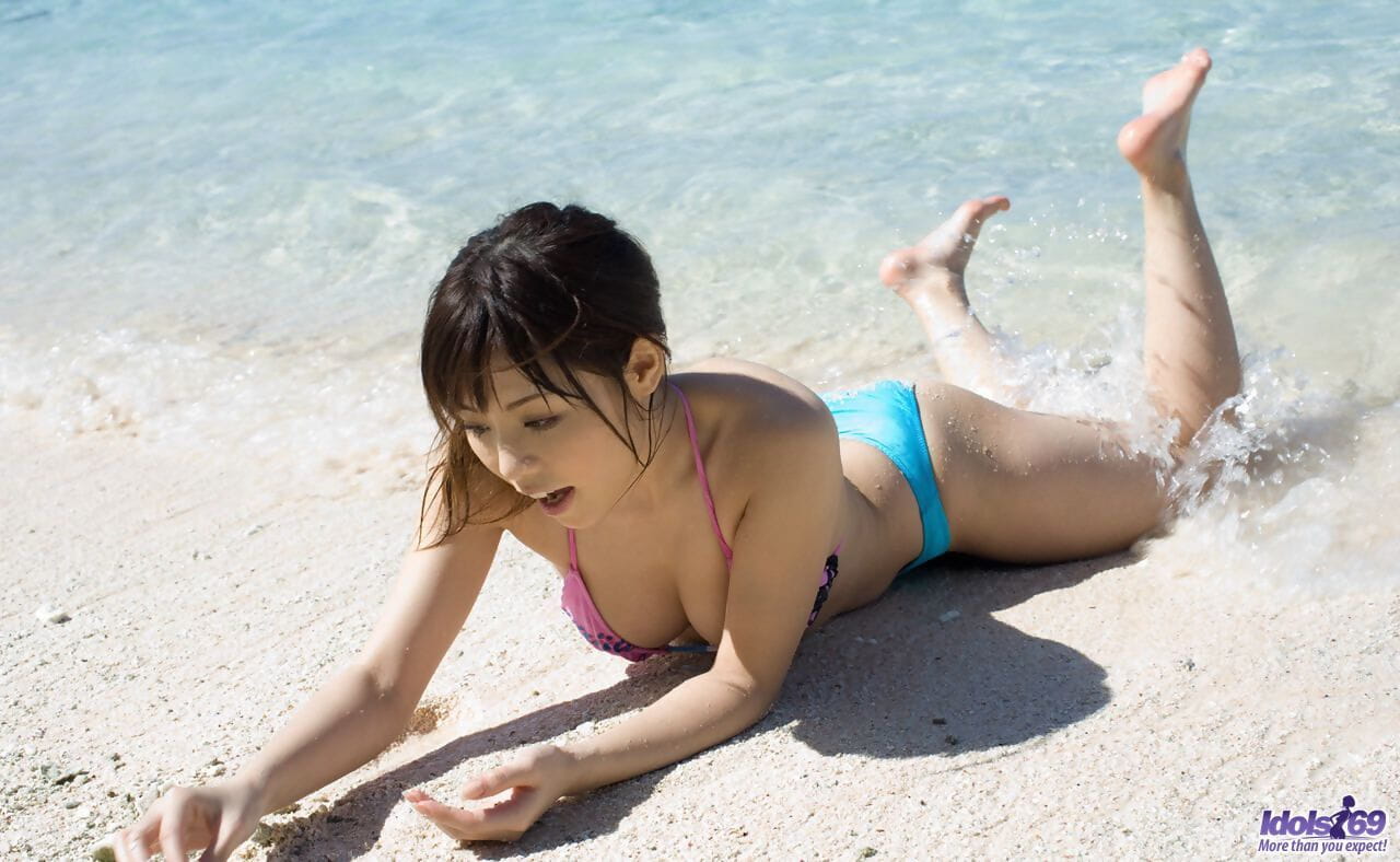 Sexy Japanese girl Aya Hirai gets naked on a tropical beach during solo action