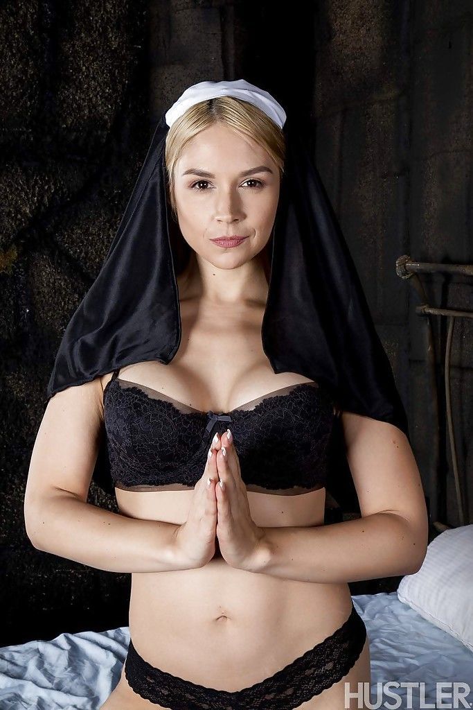 Blonde babe Sara Sloane strips off nun\'s uniform to expose big tits