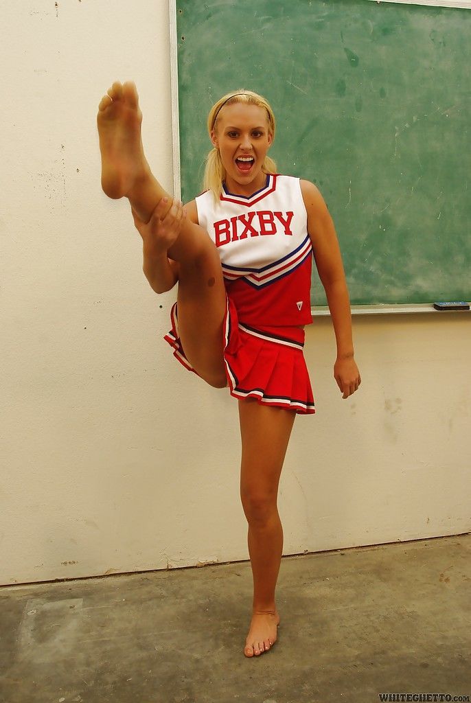 Nasty cheerleader Jamey James stripping and exposing her bare feet