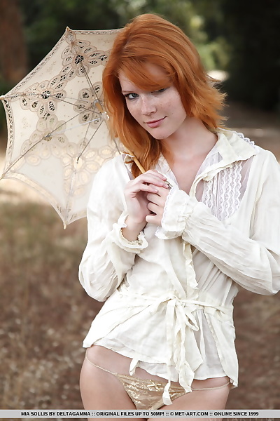 Freckled redhead Mia Sollis goes fr a nature walk completely naked