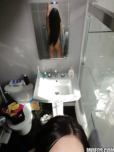 Latina brunette Danni Cole dose self shots while naked in the bathroom